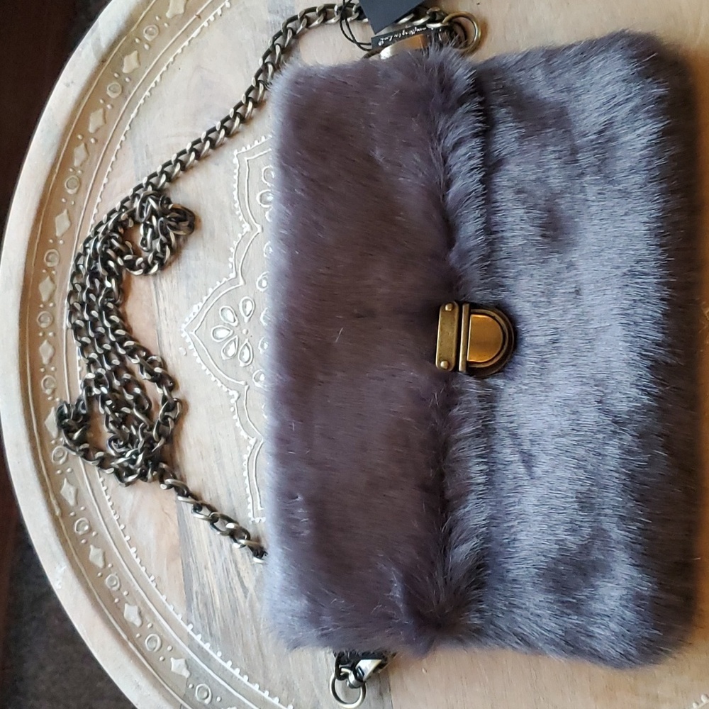Beautiful faux fur gray clutch with metal straps and closure